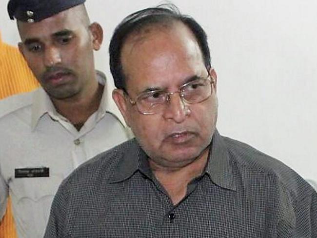 Dr. R.K. Gupta is interrogated by police in Bilaspur, India last month. AP Photo/Press Trust of India