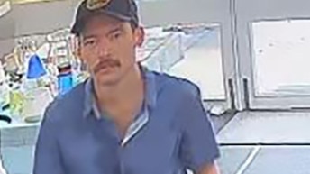 Police are searching for a man (pictured) who was seen on CCTV taking a couch from a charity shop and not paying for it. Picture: NT Police