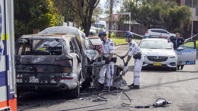 A burnt-out Audi Q7, which police are investigating as to whether it is linked to the fatal shooting of two women in southwest Sydney. Picture: Liam Mendes