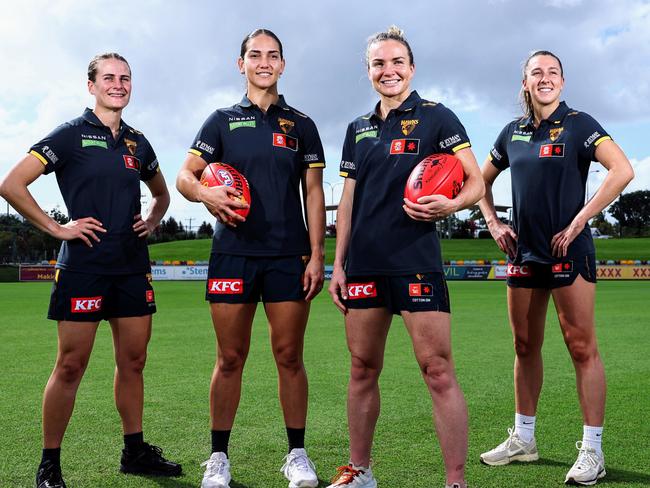 The Hawthorn Hawks AFL Women's team will play a game in Cairns for a second season, when they take on the Melbourne Demons at Cazalys Stadium on October 24. Hawks players Greta Bodey, Mattea Breed, Emily Bates and Casey Sherriff are looking forward to playing in front of a large and enthusiastic Far North Queensland crowd. Picture: Brendan Radke