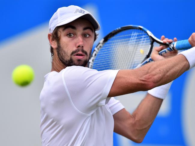 Australia's Jordan Thompson returns to Sam Querrey of the US during their men's singles second round tennis match at the ATP Aegon Championships tennis tournament at Queen's Club in west London on June 22, 2017. Querrey won 7-6, 3-6, 6-3. / AFP PHOTO / GLYN KIRK