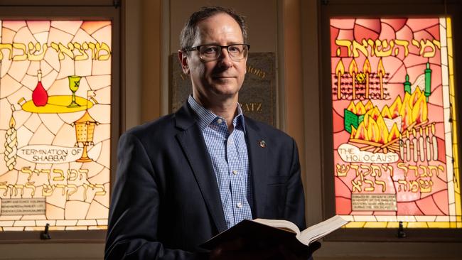 24-01-2022 Jason Steinberg who is on the organising committee to build the Queensland Holocaust Museum in Brisbane. They are putting a call out to the community to come forward with personal stories, artefacts to display at the museum. Pictured in front of stain glass windows remembering the holocaust victims at the Brisbane Synagogue. PICTURE: Brad Fleet