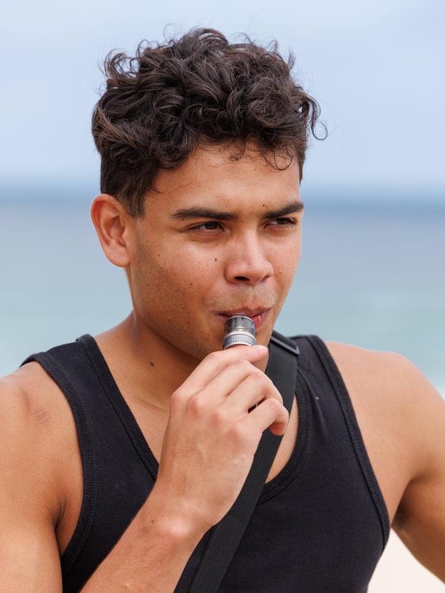 Luca Cruzado, 20, at Bondi on Thursday, switched cigarettes for vaping after a trip to hospital. Picture: David Swift