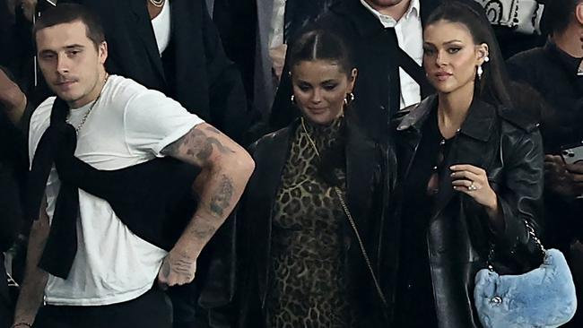 Gomez watches a soccer game with Brooklyn Beckham and his wife Nicola Peltz. Picture: Franck Fife/AFP