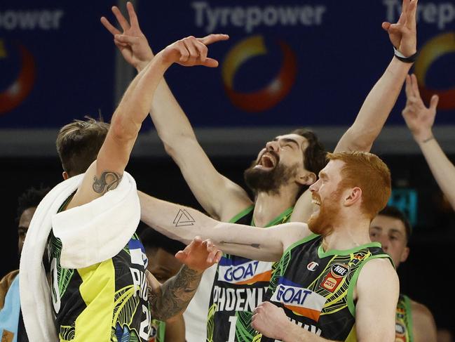 Derrick Walton Jr, Jordan Hunter, Nathan Sobey and Angus Glover of the Phoenix celebrate a Luke Rosendale three pointer in the final seconds against Cairns. Picture: Daniel Pockett/Getty Images