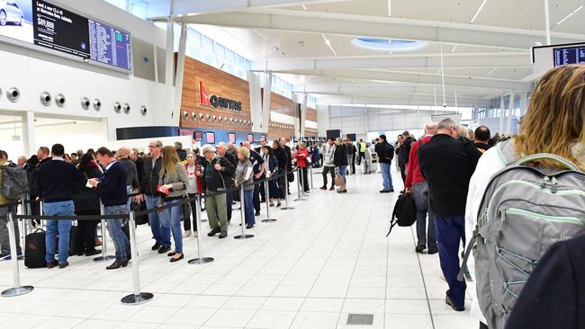 Passengers queuing up at the Adelaide Airport security checkpoint. Picture: AAP / Keryn Stevens