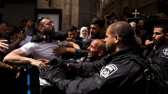 Police officers clash with attendees of the funeral of Al Jaseera reporter Shireen Abu Akleh who was  shot by a live bullet on the morning of  Wednesday May 11. Picture: Getty Images
