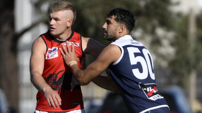Marlion Pickett makes his Melton South debut, taking on Romsey’s Kane Brinkhuis. Picture: Andrew Batsch