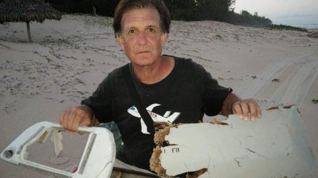 Plane wreck hunter Blaine Gibson with pieces of debris from the missing MH370 found in Madagascar. Picture: Supplied