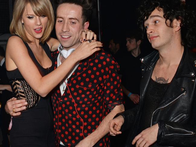 A 2015 photo of Taylor Swift, Nick Grimshaw and Matt Healy (right). Picture: David M. Benett/Getty Images for Soho House &amp; Bacardi