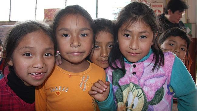 Schoolchildren in Peru. Don't forget to show the kids the photo as some will not be used to digital cameras and ...