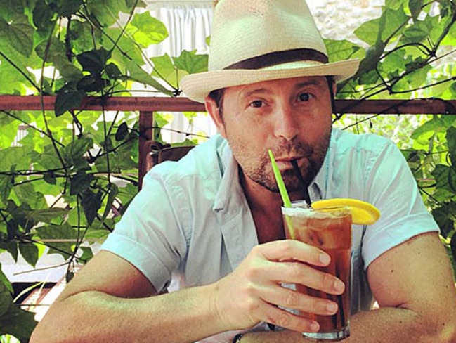 Hidden gem...Steve Jacobs enjoys a cool drink in Vanuatu. Picture: Supplied.