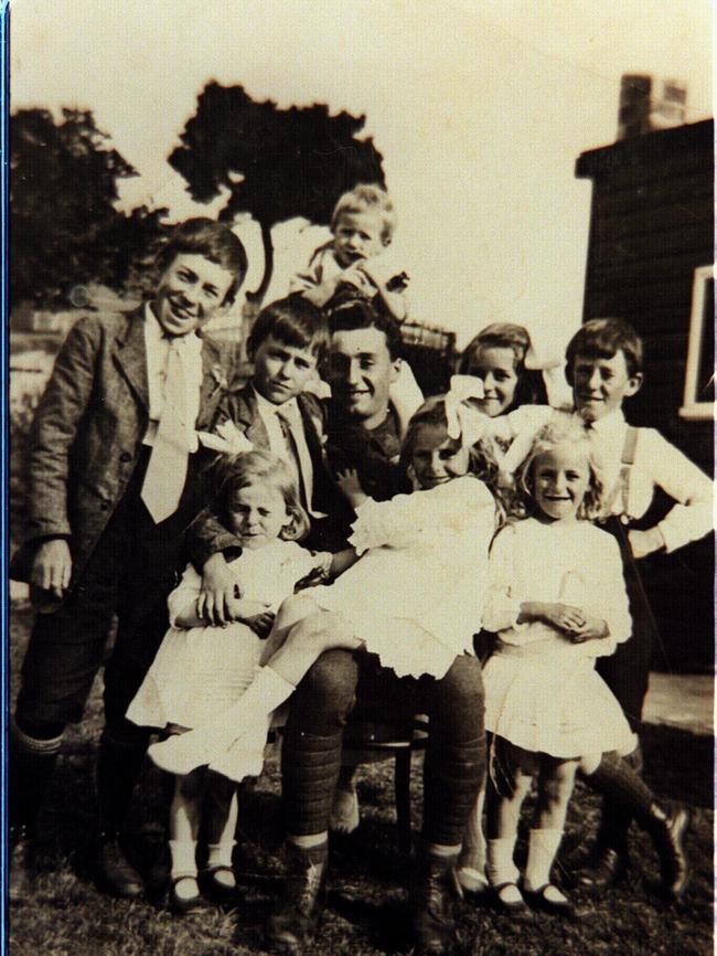 Ted surrounded by family and friends after returning home.