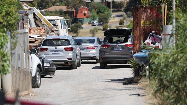 Police at the scene on Morrow Road, Lonsdale, during a search for evidence in the investigation into the death of Jeff Mundy. NCA NewsWire / David Mariuz