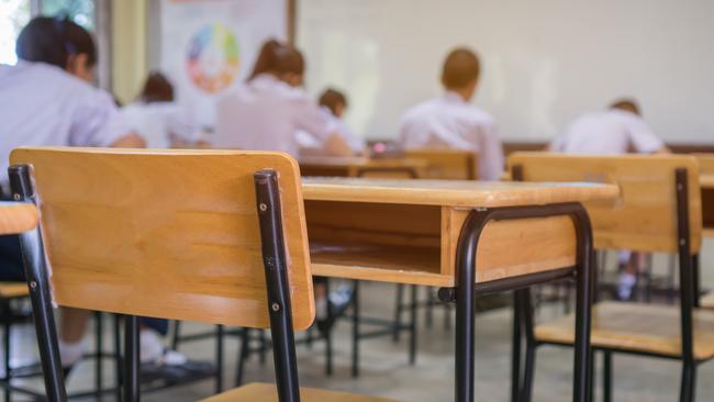 Lecture room or School empty classroom with Student taking exams, writing examination for studying lessons in high school thailand, interior of secondary education, whiteboard. educational concept