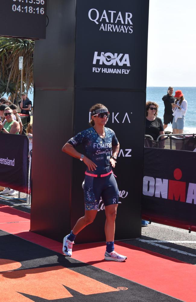 Athletes crossing the finish line at the Sunshine Coast Ironman 70.3 2023.