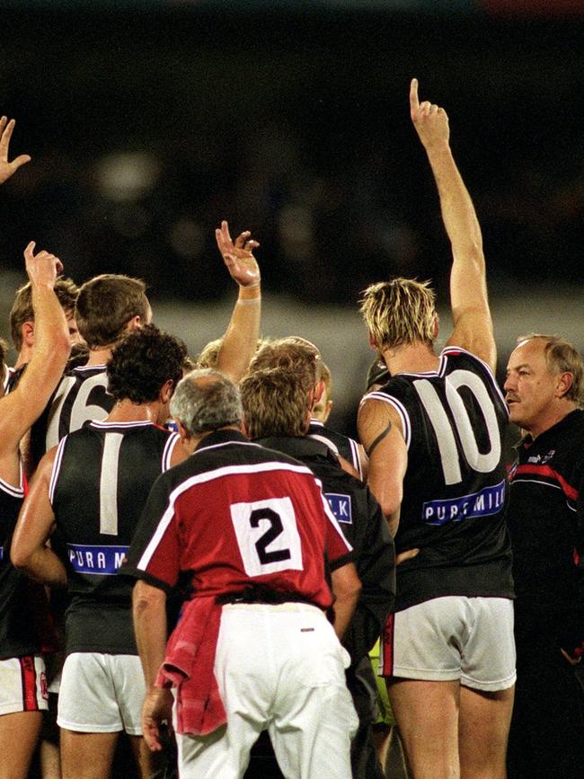 Blight speaks to his St Kilda players during a game.