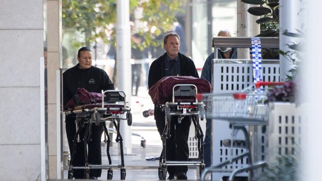 NSW Police and Forensics teams work to remove bodies at the scene on Sunday after six people died, and many others were injured, including a nine-month-old baby. Picture: NCA NewsWire / Monique Harmer