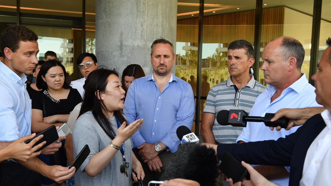 Angry Opal Tower residents confront Icon managing director Julian Doyle. Picture: Mick Tsikas/AAP