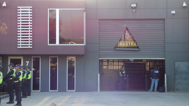 Police search a Comancheros clubhouse.