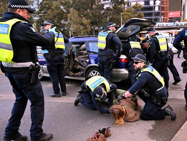 Police make arrests on the King Street Bridge. Picture: William West