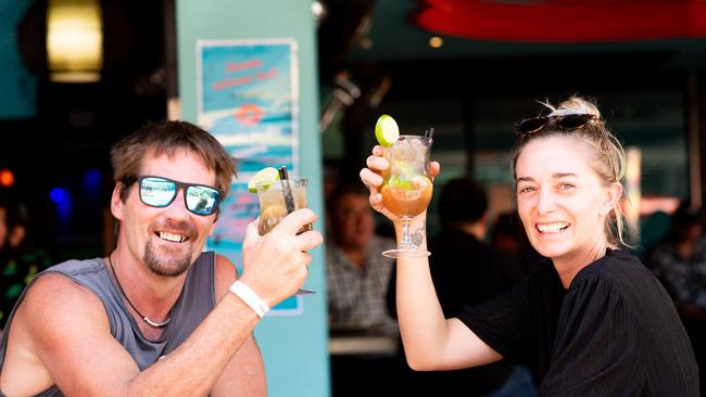 Rick Conway and Gabby Brady knock back Bullfighters at Monsoons Restaurant and Party Bar, Darwin on the day that pubs reopened after the COVID shutdown last year. Picture: Che Chorley