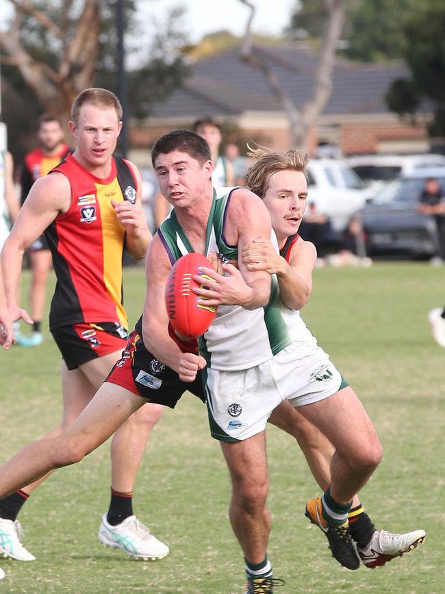Bell Park's Fraser Marris tries to handball. St Joseph's v Bell Park GFNL Football. Picture: Alan Barber