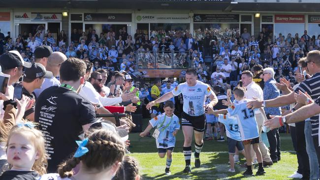 Paul Gallen leads the Sharks out before the Round 24 NRL match against Canberra. Picture: AAP