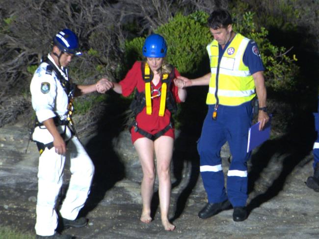 Emergency crews assist a woman at the scene. Picture: OnScene Bondi