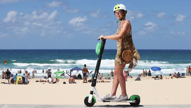 Emme McCarthy, 14, from Brisbane tries out the new Lime e-scooters. Photo: Glenn Hampson