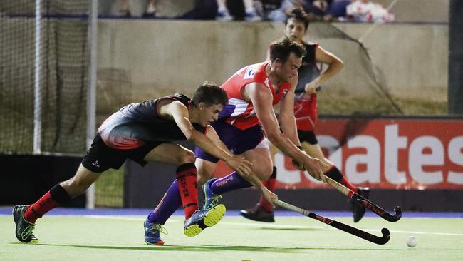 Souths' Josh Fowler and Stingers' Dan Ginnaw fight for possession in the Cairns Hockey senior men's match between the Trinity Stingers and South Cairns. PICTURE: BRENDAN RADKE