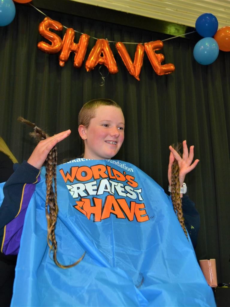 At the St Joseph's College 2023 World's Greatest Shave event is Meghan Ellis getting her cut by hairdresser Caitlin Symes from the Hair Room on Russell. Picture: Rhylea Millar