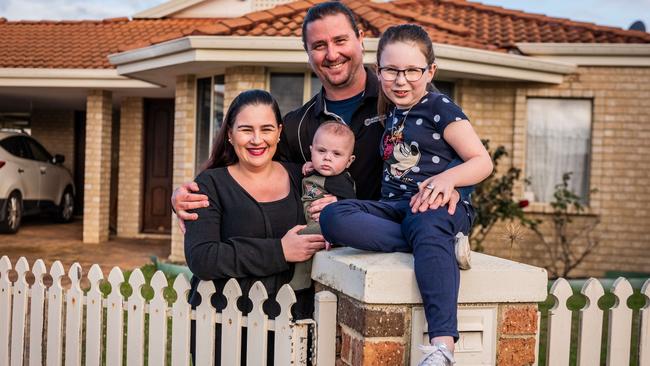 Ben and Elise Keeler with their children, Arabella and baby Luka, at their rental property in Helena Valley near Perth on Monday. Picture: Tony McDonough.