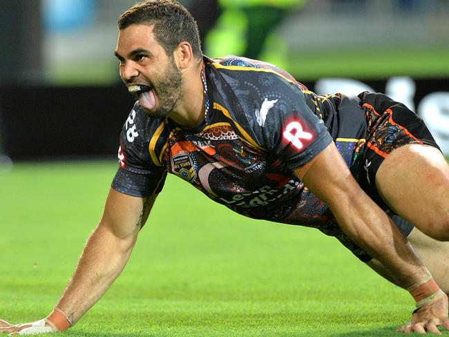 Greg Inglis scores a try for the Indigenous All Stars last Friday and marks it with his goanna celebration