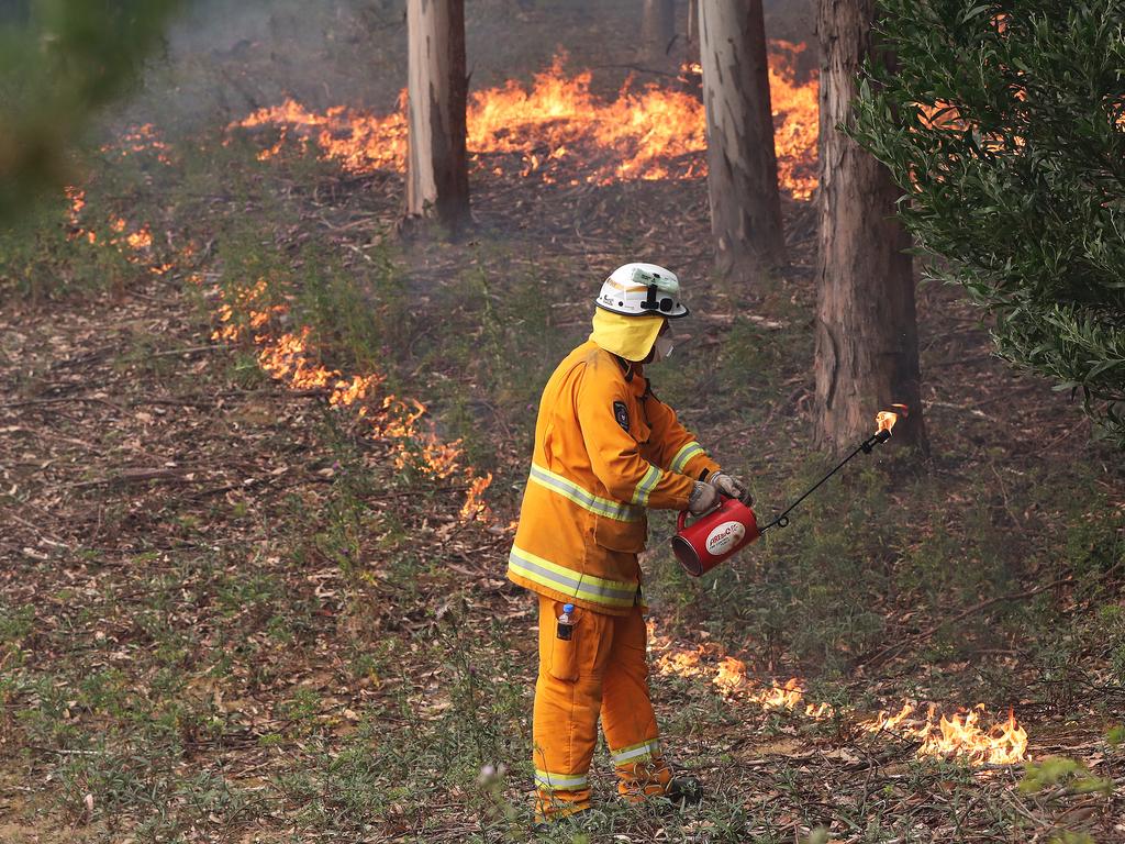 January 2019 Tasmanian Bushfires. Dylan Murphy from Kingston Fire Brigade helping to put in a controlled fire break behind a home on Donnellys Rd, Geeveston, in the Huon Valley. Picture: NIKKI DAVIS-JONES