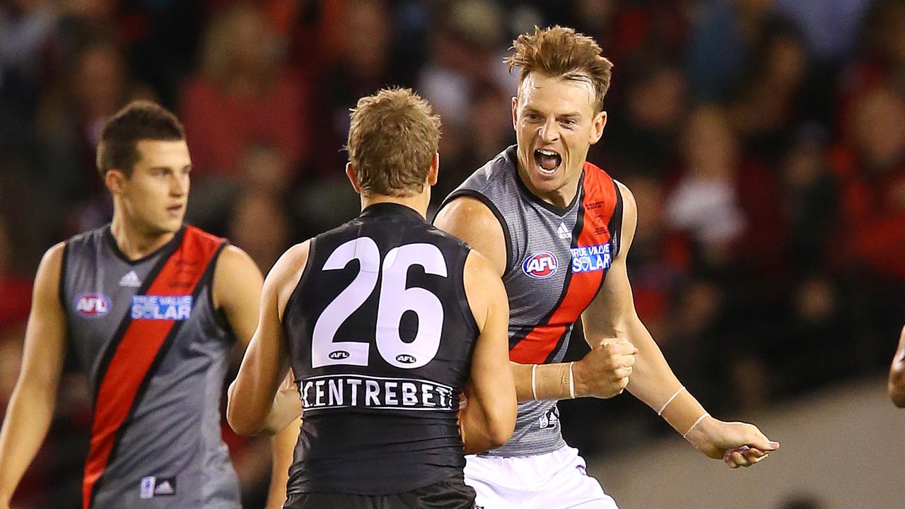 Nick Dal Santo gets stuck into Brendon Goddard. 