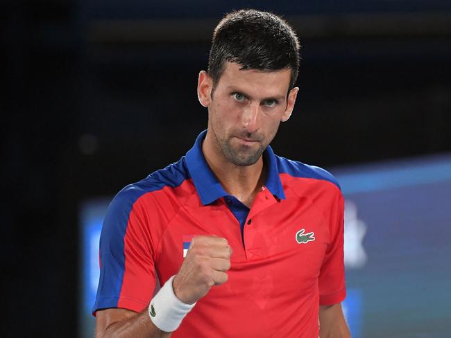 Serbia's Novak Djokovic celebrates during his Tokyo 2020 Olympic Games men's singles quarterfinal tennis match against Japan's Kei Nishikori at the Ariake Tennis Park in Tokyo on July 29, 2021. (Photo by Tiziana FABI / AFP)