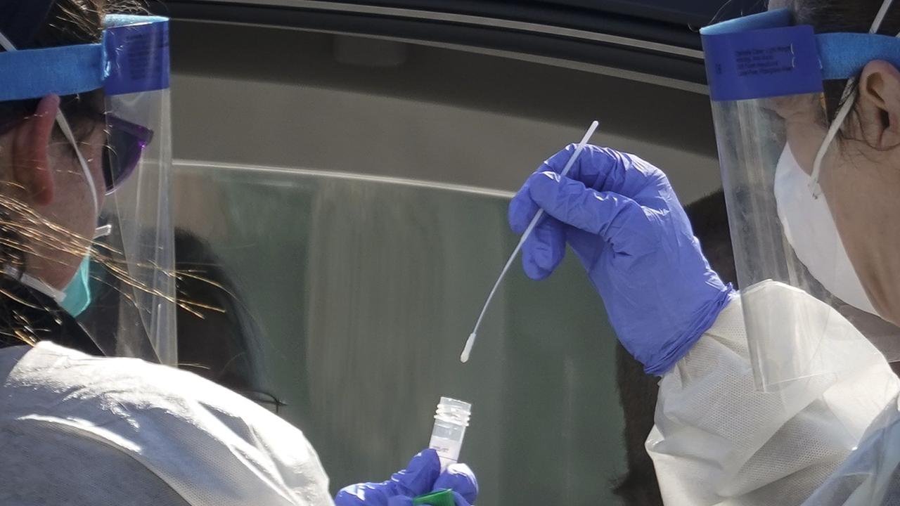 The swab goes far into the nostril. Picture: Drew Angerer/Getty Images/AFP