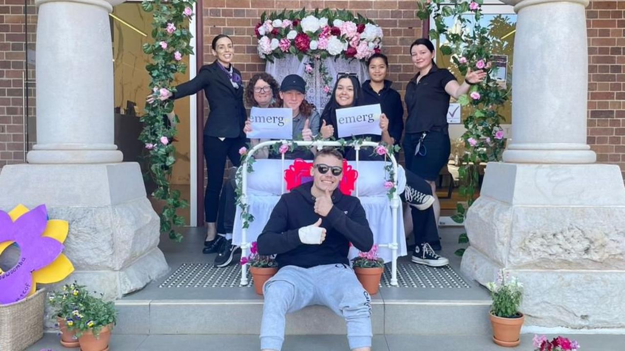 At the flower bed' display outside Quest Toowoomba are (from left to right) Rikki Cutts, Jenny O'Reilly, Ethan Peterson, William Doidge, Pearl Nilsen, Jhozel Trecene and Jess Otto.