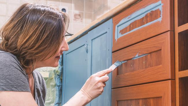 Painting the cabinetry is a cheap and effective way to modernise the kitchen.