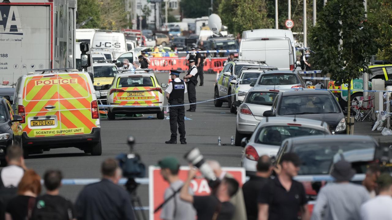 Onlookers near the attack north of Liverpool. (Photo by Christopher Furlong/Getty Images)