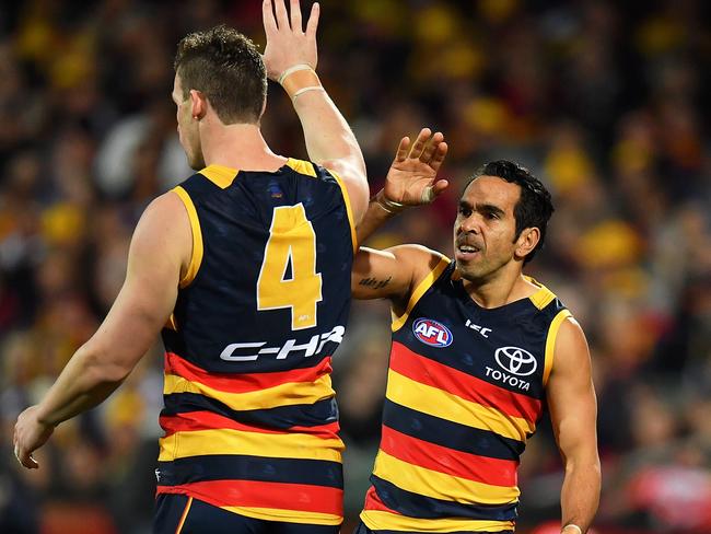 ADELAIDE, AUSTRALIA - JULY 21: Josh Jenkins is congratulated by Eddie Betts of the Crows after kicking a goal during the round 18 AFL match between the Adelaide Crows and the Geelong Cats at Adelaide Oval on July 21, 2017 in Adelaide, Australia.  (Photo by Daniel Kalisz/Getty Images)