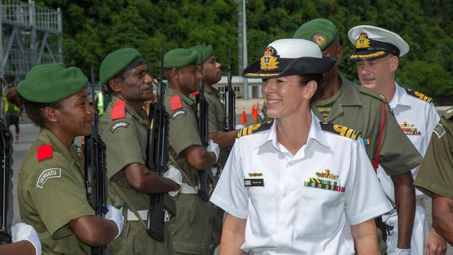 Royal Australian Navy Task Group 637 Commanding Officer, Commander Phillipa Hay, inspects the Vanuatu Police Mobile Force Guard during a welcoming ceremony at Lapetasi Wharf, Port Vila, Vanuatu.