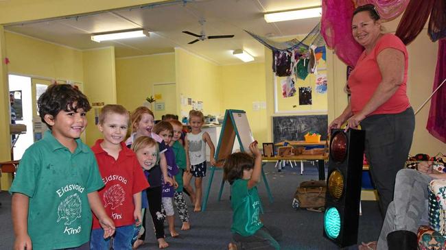 GREEN SAYS GO: Leesa Beasley with Eidsvold Kindy's new traffic light. Picture: Alex Treacy