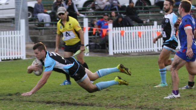 Shane Rowe scoring one of his five tries for Norwest Polecats against ACU.