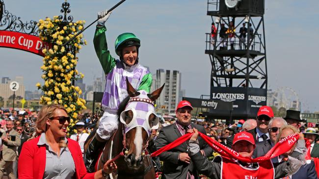 Michelle Payne celebrates winning the Melbourne Cup on Prince Of Penzance.