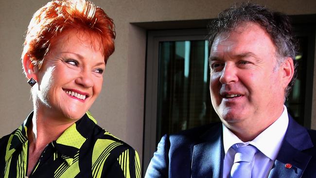 Pauline Hanson and Rod Culleton (right) gather for photos in Parliament.