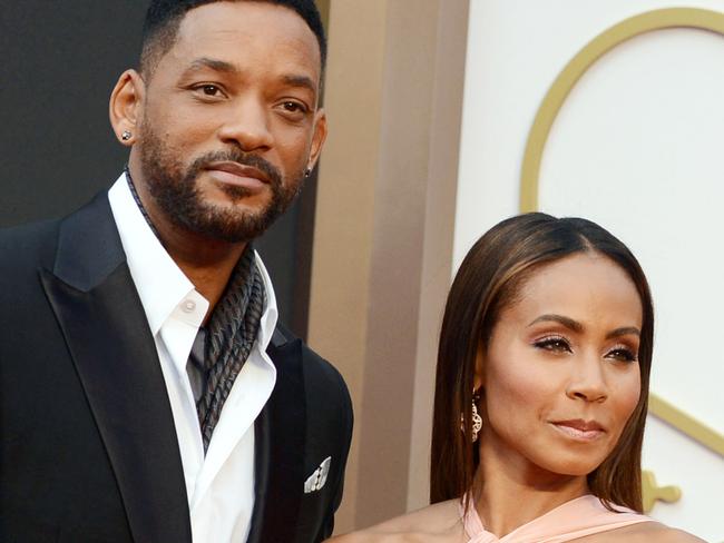 FILE - In this March 2, 2014, file photo, Will Smith, left, and Jada Pinkett Smith arrive at the Oscars at the Dolby Theatre in Los Angeles. Smith said Thursday, Jan. 21, 2016, he will not attend the Academy Awards next month, joining his wife, Jada Pinkett Smith, and others in protest against two straight years of all-white acting nominees. (Photo by Jordan Strauss/Invision/AP, File)