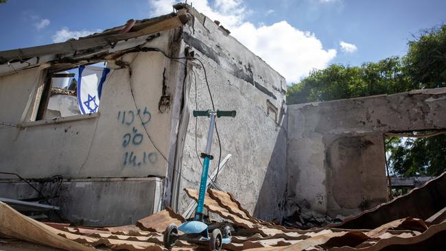 A child’s scooter is all that remains in the remains of a destroyed home at kibbutz Kfar Aza in Israel’s south. Picture: Liam Mendes