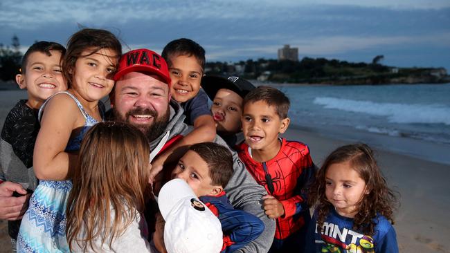 Former NRL star George Rose with a group of children from his home town of Walgett. George is a leader for the Indigenous community.